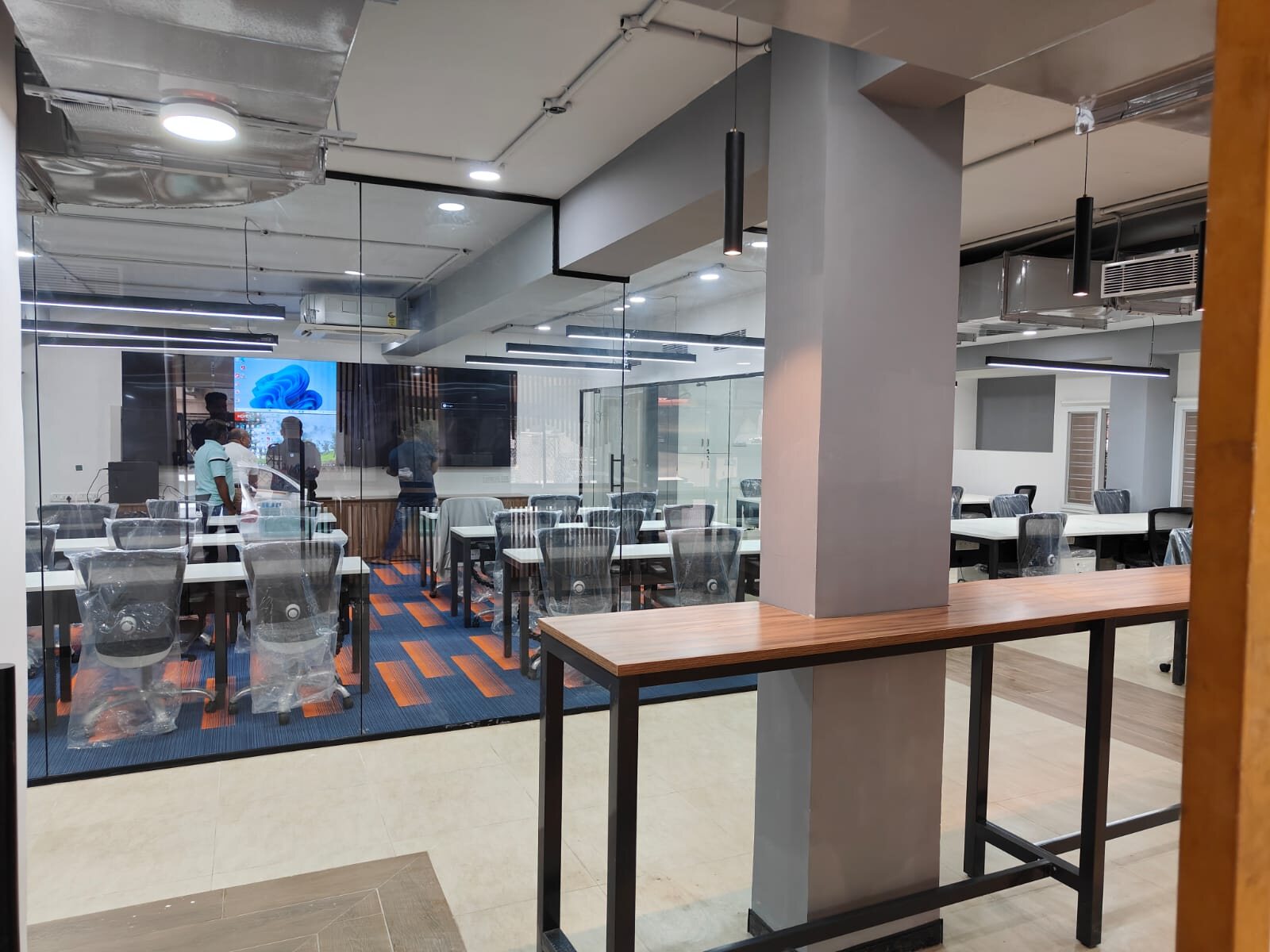 Completed office fitout by RC Workspace Bengaluru — glass partitions, HVAC and lighting